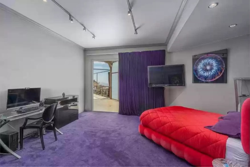 The Huge House Has Four Bedrooms And Six Bathrooms.