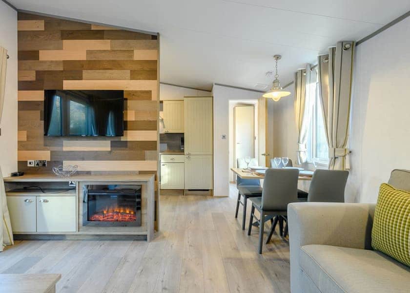 Landal Kenwick Woods Is A Lodge Village Surrounded By Lush Trees And Located On The Edge Of A Hotel Complex And A Golf Course.